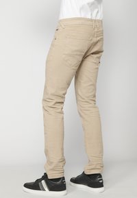 Koroshi STRETCH - Džíny Straight Fit - beige