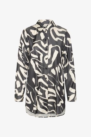 Košulja s dugim rukavima i kopčanjem na gumbe, s apstraktnim uzorkom poteza četkicom u crno-bijelim tonovima i oštrim ovratnikom.
