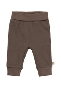 Braune gerippte Hosen aus weichem Stoff, mit einem breiten Bund, elastischen Bündchen und einem kleinen Etikett auf der Seite.