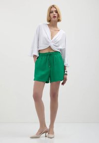 Calliope Pantaloni sportivi - verde