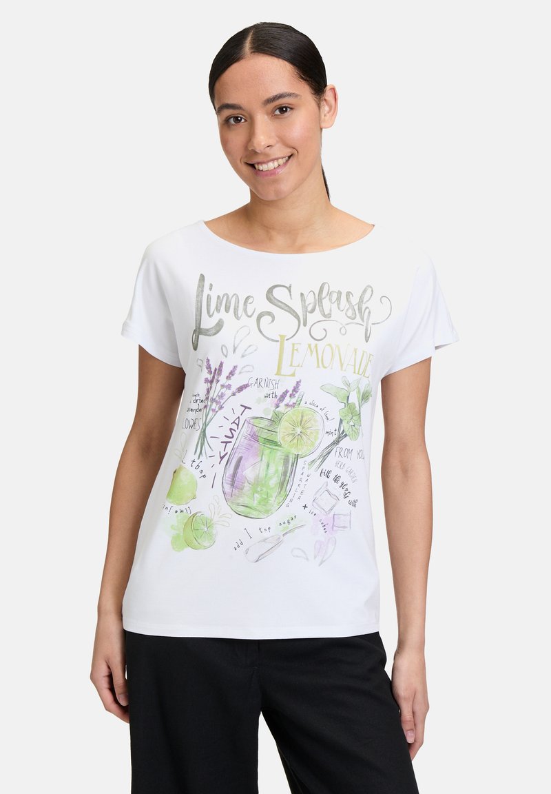 Biała koszulka z krótkim rękawem z kolorową grafiką "Lime Splash Lemonade" z ilustracjami limonek i lawendy, w luźnym kroju.