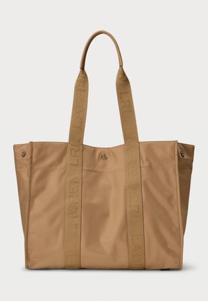 Tan tote bag with two woven straps labeled “LAUREN” and a metal logo accent. Made of smooth, durable material with stitched detailing.