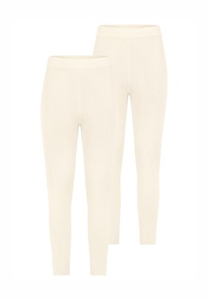 Cremfarbene, gerippte Leggings mit figurbetontem Design und elastischem Bund, zeichnen sich durch eine glatte Textur und nahtlose Verarbeitung aus.