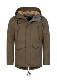 Parka vert olive avec une capuche bordée de gris, intérieur en polaire beige douce, deux poches poitrine et un cordon de serrage ajustable à l'ourlet.