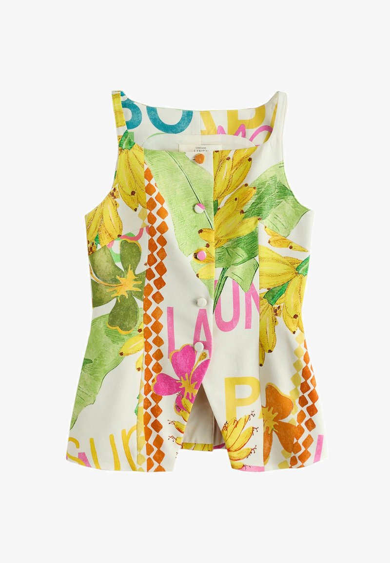 Haut blanc sans manches avec imprimé tropical coloré de bananes, fleurs, feuilles vertes et texte multicolore partiel, avec fermeture boutonnée à l’avant.