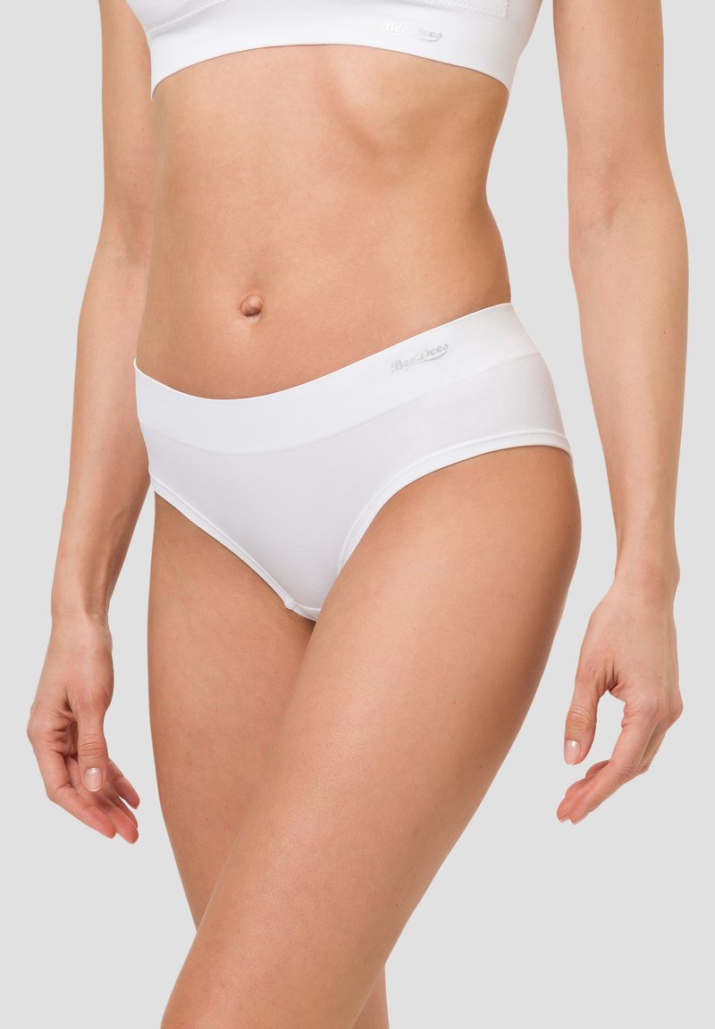 White cotton hipster underwear with a smooth waistband. Features a seamless design for comfort and a snug fit. Brand logo displayed on waistband.