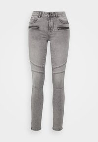 Jeans de denim cinza ajustados com bolsos frontais com fecho, detalhes em painel nos joelhos e uma textura suave. Design clássico de cinco bolsos.