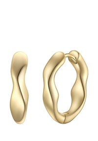 Arany színű karika fülbevalók hullámos, organikus formával. Simább felületek és lekerekített élek jellemzik, hangsúlyozva a folyékony, szobrászati dizájnt.