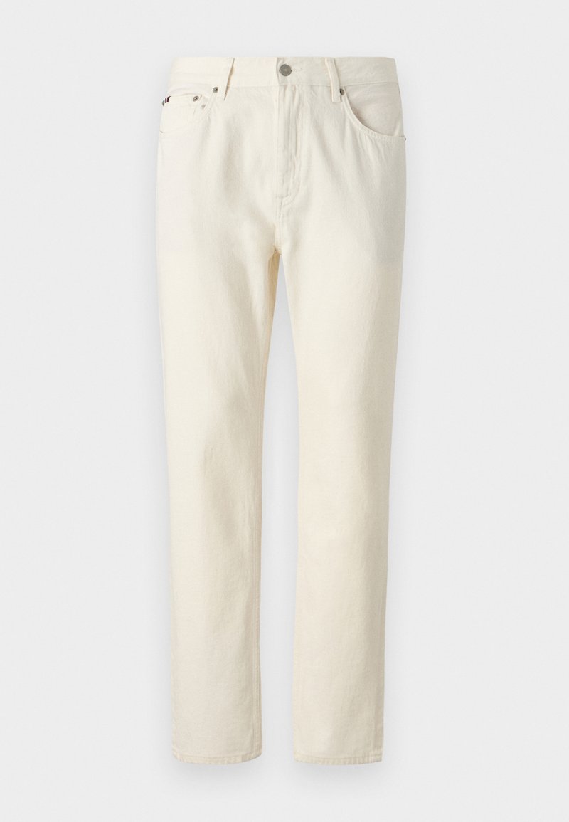 Crème-kleurige denim jeans met een rechte snit, uitgerust met vijf zakken, een knoop- en ritssluiting, en zichtbare stiksel-details.