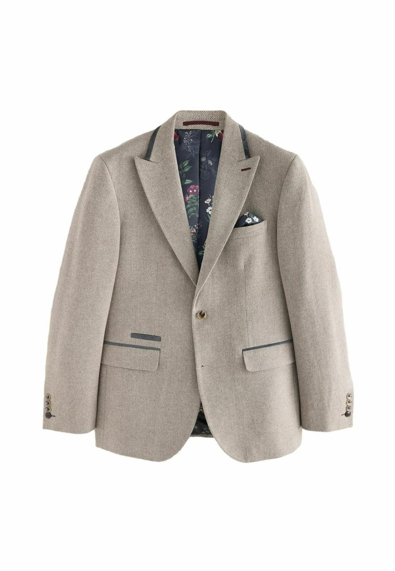 Blazer beige con patrón de pata de gallo, cuenta con dos bolsillos delanteros, un bolsillo en el pecho y un forro con patrón floral. Cierre de un solo botón.