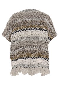 Kort stickad poncho med zigzag-mönster i beige, brunt, senap och svarta nyanser, med fransar vid fållen.