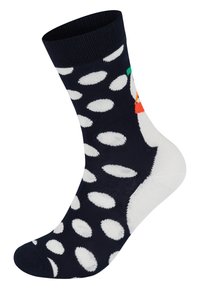 Chaussette marine avec des pois blancs, un accent coloré près du haut ressemblant à une tête d'oiseau, et une texture douce.