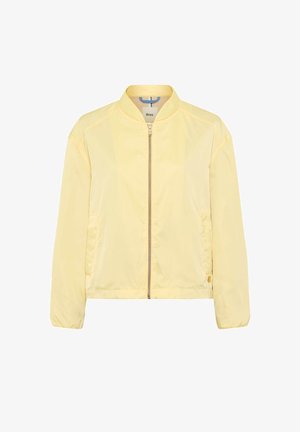 Light yellow bomber jacket with front zipper, elastic cuffs, two side pockets, and a small brand tag on the hem.