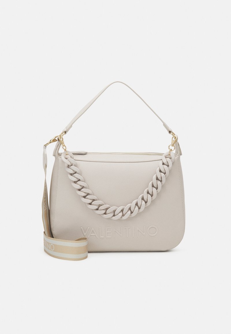Beige leather handbag with a braided handle and gold hardware. Features a zip closure and a detachable strap with a striped pattern.