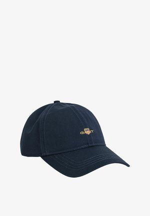 Marineblaue Mütze aus Baumwolle mit gebogenem Schirm, gesteppten Details und einem kleinen gestickten Logo auf der Vorderseite.