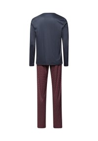 Toppik long-sleeve tummansininen yhdistettynä punaisiin kuvioituihin housuihin, joissa on timanttimuotoilua. Materiaali vaikuttaa sileältä ja on rento istuvuus.