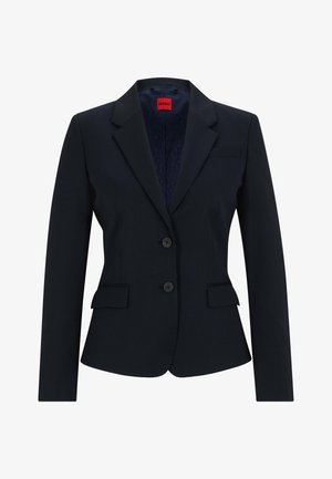 Navy blue blazer in tailored design featuring a notched lapel, two-button closure, and two front pockets. Lined interior with logo pattern.