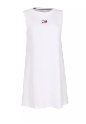 Sleeveless white casual dress with a small rectangular Tommy Jeans logo patch centered near the neckline.