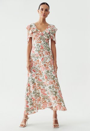 Floral maxi dress with short, ruffled sleeves, featuring a white base, pink and green floral patterns, and a flowing silhouette.