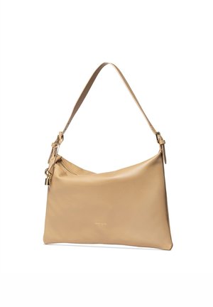 Sac à épaule en cuir beige avec sangle réglable, breloque cadenas dorée et fermeture éclair, nom de la marque subtilement embossé sur le devant.