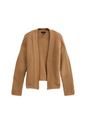 Gilet en tricot de couleur beige clair, présentant un motif texturé, une ouverture sur le devant et des poignets côtelés. Le design inclut une silhouette décontractée.