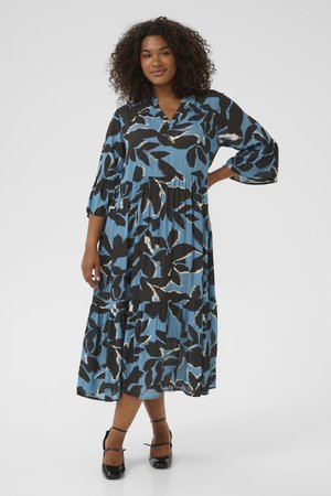 Blue and black floral-patterned dress with a V-neck, three-quarter sleeves, and tiered skirt. Smooth fabric with a loose-fitting design.