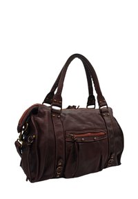 Sac à main en cuir marron avec double anses, fermetures zippées et coutures décoratives. Dispose d'une poche avant et de accents en laiton.