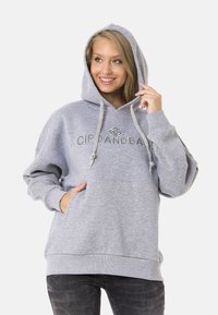 Grauer Kapuzenpullover mit Kordelzug, Fronttasche und besticktem Logo. Hergestellt aus weichem Stoff mit lockerer Passform.