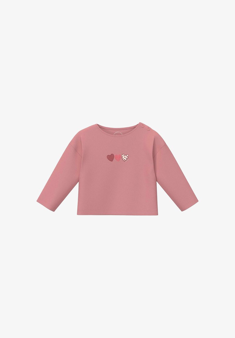 Chemise bébé rose à manches longues avec encolure ronde, deux boutons sur l'épaule et trois petits motifs en forme de cœur au centre devant.
