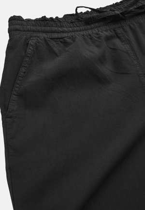 Mustat rennot housut, joissa on joustava vyötärönauha ja kiristysnyöri, etutaskut ja rento istuvuus kankaan tekstuurissa.