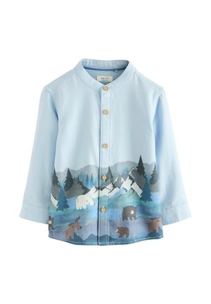 Light blue long-sleeve shirt with a round collar, featuring a colorful nature-themed print with mountains, trees, and wildlife at the hem.