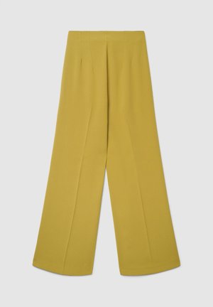 Pantaloni a gamba larga in tessuto liscio di un vibrante giallo senape. Presentano pieghe frontali e una silhouette strutturata.