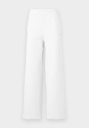 Pantaloni de trening albi, cu croi larg, dintr-un amestec moale de bumbac, cu talie elastică și o cusătură curată, minimală. Fără buzunare sau modele.