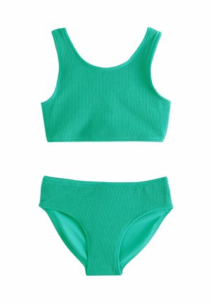 Vihreä neulottu bikinit, jossa on teksturoitu toppi ja yhteensopivat alaosat, joissa on sileä vuori. Yksinkertainen, siisti muotoilu elävässä vihreässä väressä.