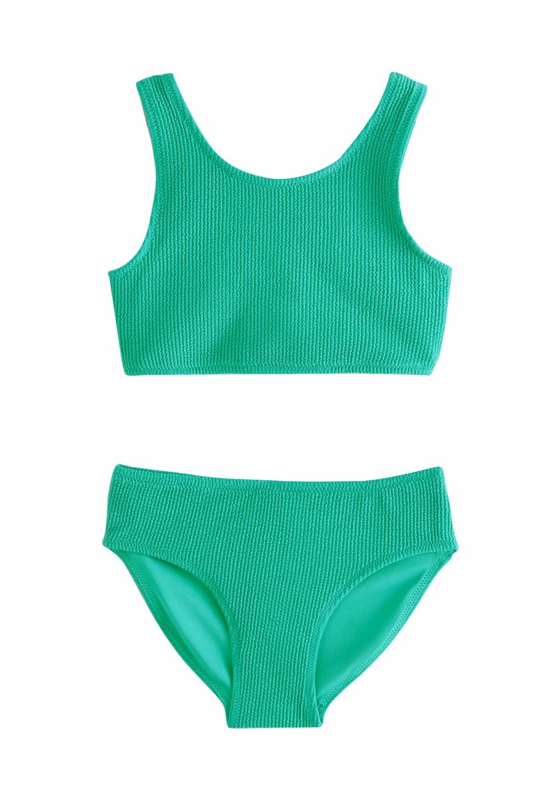 Zelený pletený bikiny, které mají strukturovaný crop top a odpovídající spodní část s hladkou podšívkou. Jednoduchý, čistý design v živé zelené barvě.