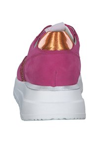 Pink sneaker with a smooth suede finish, metallic accents in gold at the heel, and a white rubber sole. Machine-stitched details visible.
