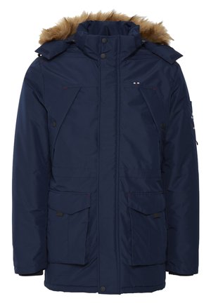 Tengerészkék szigetelt dzseki szőrmebéléssel ellátott kapucnival, cipzáras záródással, több elülső zsebbel és kontrasztos varrási részletekkel.