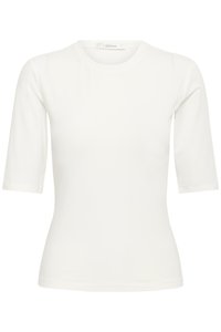 White fitted short-sleeve top with round neckline and label "GESTUZ" at the collar.