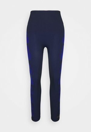Leggings azul-marinho com um cós alto, apresentam um padrão abstrato azul ao longo do lado. Feitos de um tecido elástico e suave para conforto.
