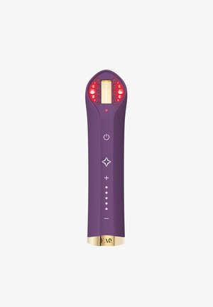 Purple handheld device with a gold base, featuring a luminous display, red LED indicators, and control buttons on the front.