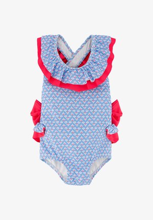 Peto azul para bebé con estampado floral blanco y rosa, ribete rojo con volantes alrededor del escote y los laterales, y tirantes cruzados en la espalda.