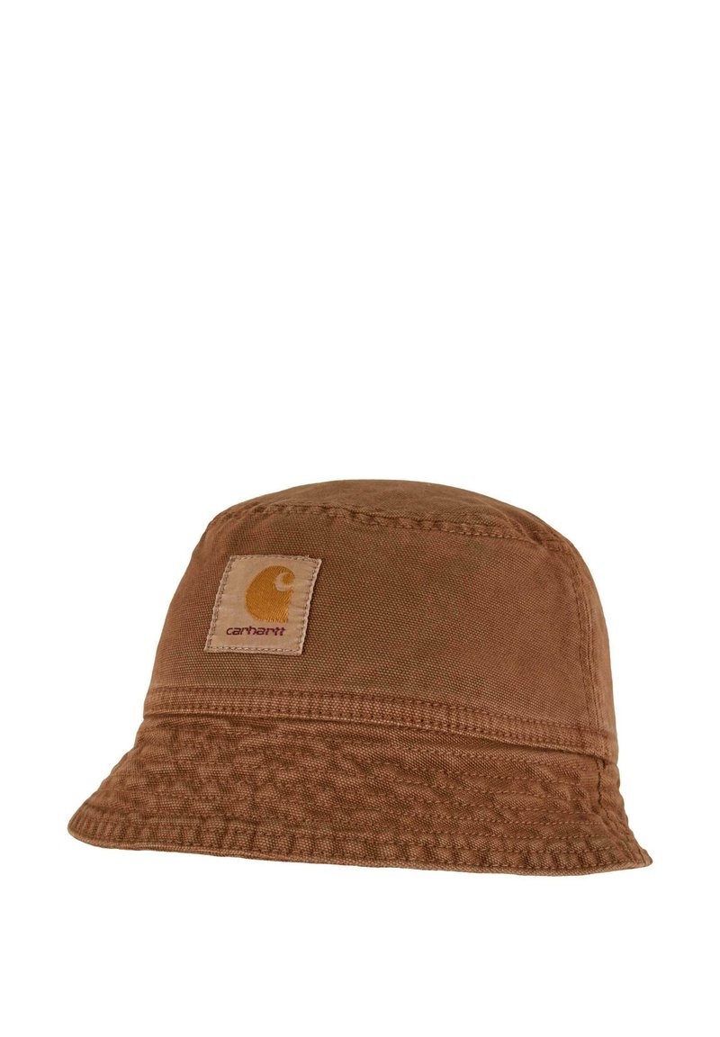 Brown Carhartt bucket hat with stitched logo patch on front, featuring a wide, textured brim and soft fabric construction.