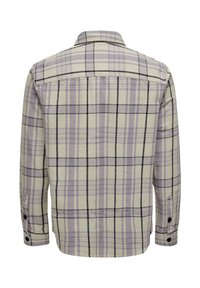 Back view of a long-sleeve shirt in light beige with purple and black plaid pattern, featuring a classic collar and button cuffs.
