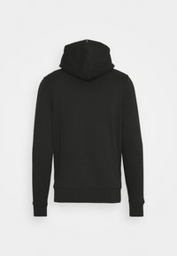 Hoodie noir à manches longues vu de dos, avec une capuche et des poignets côtelés, sur un fond clair uni.