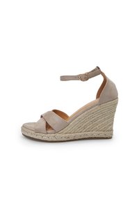 Beige wedge sandals with a textured suede upper, crisscross straps, and an adjustable ankle strap. Woven jute detail on the wedge.