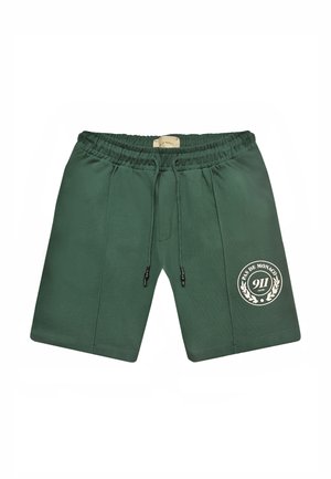 Vihreät elastiset vyötäröshortsit, joissa kiristysnaru ja vasemmassa lahkeessa valkoinen "Pas de Monaco 911 Club" -logo.