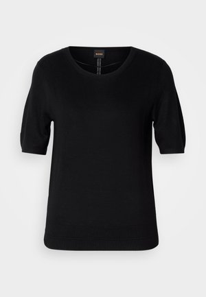 Svart kortermet strikket topp med rund hals, ribbestrikket kant og subtil tekstur, med en logoetikett i midten bak.