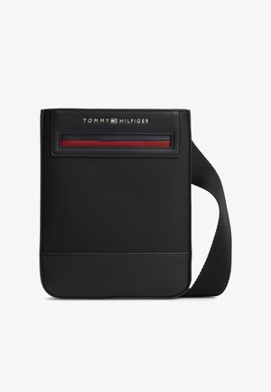 Black crossbody bag with a textured finish, featuring a red accent stripe and a smooth base. Includes a fabric shoulder strap.