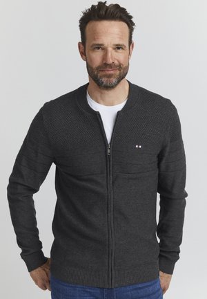 Dark gray zip-up sweater with a textured upper section, ribbed cuffs and hem, and a small logo on the left chest.