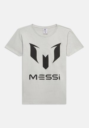 Helehall lühikeste varrukatega T-särk suure musta Messi logoga ja esiküljel keskel stiliseeritud "M" sümbol.
